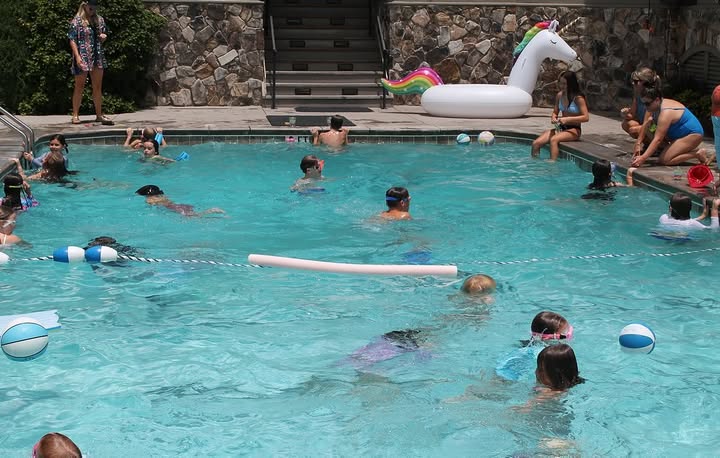 The pool at Burlingame Country Club gets plenty of use during a summer afternoon.